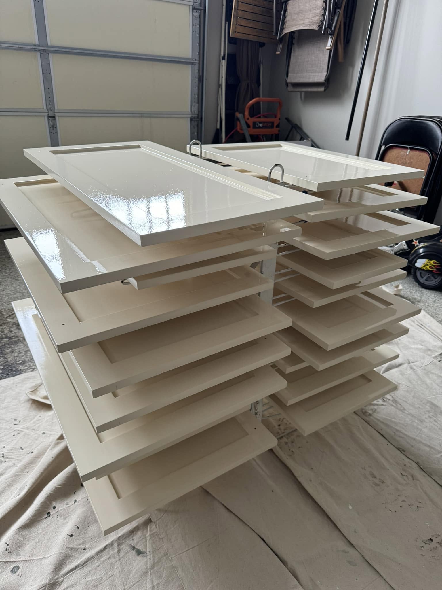 Freshly painted cabinet doors on drying rack